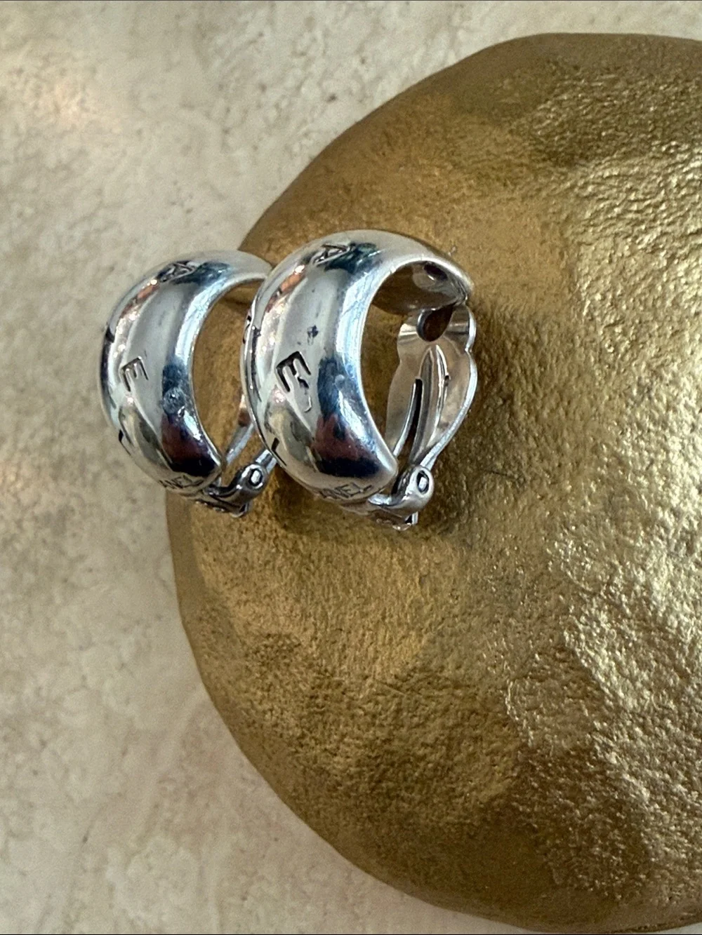 CHANEL Sterling Silver Logo Clip Hoop Earrings